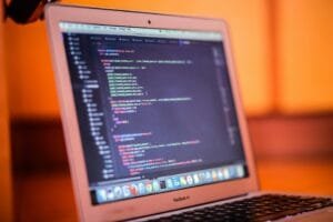 this image showing that coding interface in laptop on table in office of zumezu IT company providing web development in Delhi,